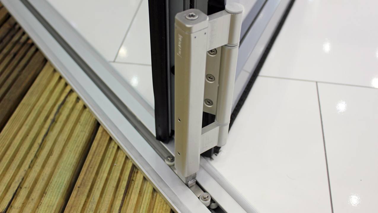 Photo of the bottom roller/track on a bi-fold door